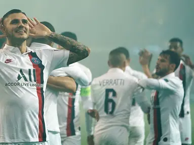 Selebrasi pemain Paris Saint-Germain (PSG) Mauro Icardi usai mencetak gol ke gawang Club Brugge pada laga Grup A Liga Champions di Stadion Jan Breydel, Bruges, Belgia, Selasa (22/10/2019). PSG menang 5-0. (Kenzo TRIBOUILLARD/AFP)