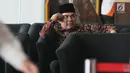 Bupati Jepara Ahmad Marzuqi menunggu panggilan penyidik saat akan menjalani pemeriksaan di Gedung KPK, Jakarta, Senin (13/5/2019). Marzuqi diperiksa sebagai tersangka terkait suap dalam putusan atas praperadilan dugaan korupsi penggunaan dana bantuan parpol di PN Semarang. (merdeka.com/Dwi Narwoko)