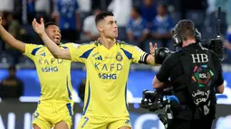 Tambahan dua gol ini membuat Ronaldo kini mengoleksi 21 gol dan bertengger di puncak top skor sementara Liga. (AFP/Fayez Nureldine)