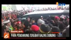 Polisi saling dorong dengan massa pendukung calon walikota Makassar nomor urut 1, Munafri Arifuddin-andi Rahmatika yang diusung oleh jalur partai.