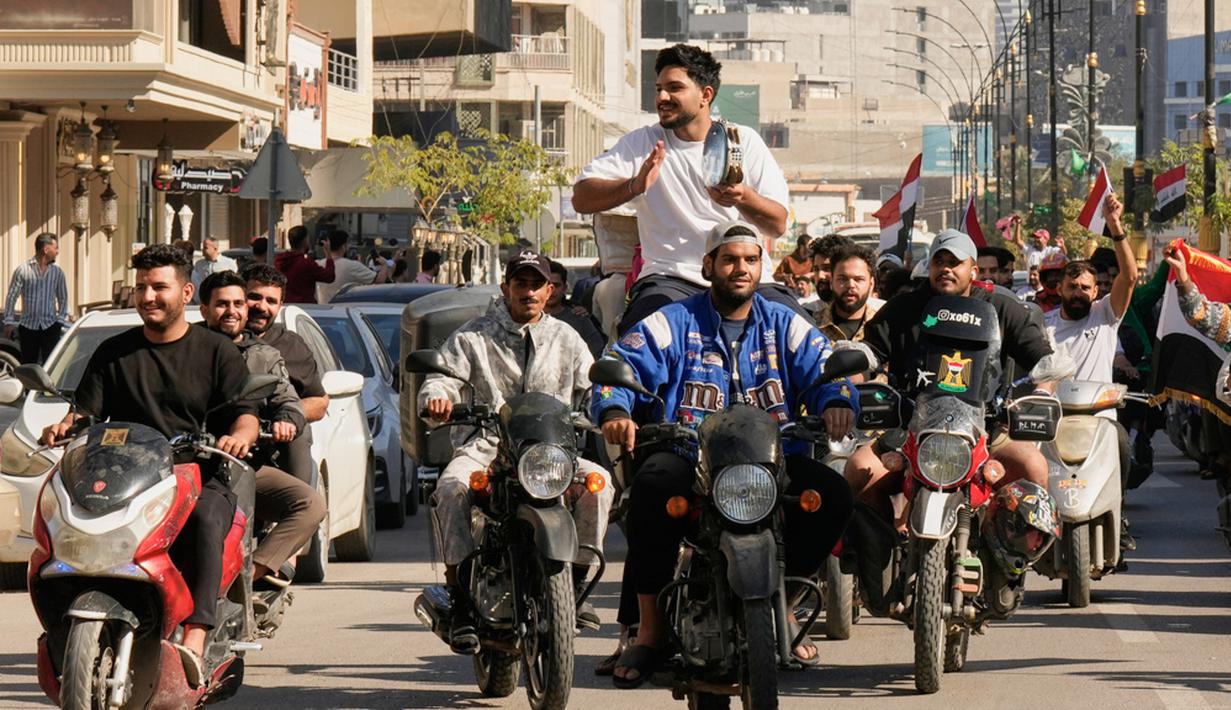 Kemenangan tersebut memastikan Singa Mesopotamia kembali tampil di putaran final Piala Dunia setelah absen selama 40 tahun. (AP Photo/ Hadi Mizban)