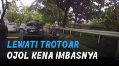 Nasib apes dialami oleh seorang driver ojol ketika berniat menghindari macet dan melewati jalur trotoar pejalan kaki.