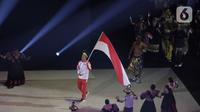 Pakaian adat membuka jalan kontingen Indonesia saat upacara pembukaan SEA Games 2019 di Philipine Arena Bulacan, Manila, Sabtu (30/11/2019). Pesta olahraga se-Asia Tenggara ini akan berlangsung hingga 11 Desember. (Bola.com/M Iqbal Ichsan)