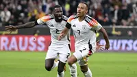 Pemain Jerman, Jamie Leweling (kanan) melakukan selebrasi bersama Antonio Rudiger setelah mencetak gol ke gawang Belanda pada laga lanjutan Grup A3 UEFA Nations League di Allianz Arena, Jerman, Selasa (15/10/2024) dini hari WIB. (AP Photo/dpa/Sven Hoppe)