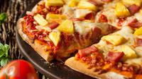 Ini 4 cara zaman now menyantap pizza dengan seru. (Foto: Istockphoto)