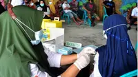 Proses vaksinasi Covid-19 di Provinsi Gorontalo (Arfandi Ibrahim/Liputan6.com)