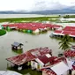 Pemukiman warga Desa Buhu, Kecamatan Telaga Jaya, Kabupaten Gorontalo menjadi langganan banjir saat hujan (Arfandi/Liputan6.com)