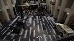 Pekerja berpose dengan karya seniman China Ai Weiwei berjudul History of Bombs di Imperial War Museum, London, Inggris, Rabu (29/7/2020). Imperial War Museum akan kembali dibuka pada 1 Agustus 2020 setelah pemerintah Inggris terus melonggarkan lockdown. (AP Photo/Matt Dunham)