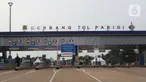 Suasana jalan Tol Kunciran-Serpong di Gerbang Tol Parigi, Tangerang Selatan, Jumat (6/12/2019). Ruas tol sepanjang 11,1 km tersebut diharapkan bisa memudahkan perjalanan masyarakat yang berasal dari arah Serpong menuju Bandara Soekarno Hatta, Cengkareng. (Liputan6.com/Angga Yuniar)