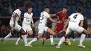 Pemain AS Roma, Paulo Dybala (kedua kanan) berusaha melewati sejumlah pemain Cagliari pada laga lanjutan Liga Italia 2023/2024 di Olympic Stadium, Roma, Italia, Selasa (06/02/2024) dini hari WIB. (AP Photo/Andrew Medichini)