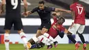 Gelandang Manchester United, Paul Pogba (kanan) berusaha menghadang gelandang Granada Yangel Herrera dalam leg kedua perempat final Liga Europa di Stadion Old Trafford, Jumat dinihari WIB (16/4/2021). MU menunjukkan dominasinya atas Granada usai mencatat kemenangan 2-0. (AP Photo/Dave Thompson)