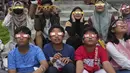 Menariknya, gerhana matahari hibrida kali ini terjadi bertepatan dengan jelang Sidang Isbat Idul Fitri 1444 H. (AP Photo/Tatan Syuflana)