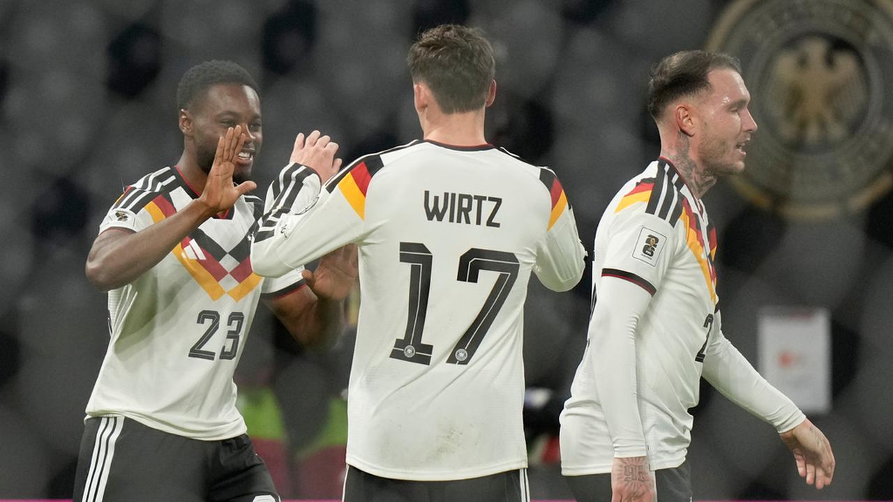 Florian Wirtz (tengah) dkk. merayakan gol Jerman ke gawang Slovakia di Grup A Kualifikasi Piala Dunia 2026 zona Eropa di Leipzig, Selasa (18/11/2025) dini hari WIB. (AP Photo/Matthias Schrader)