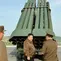 Pemimpin Korea Utara Kim Jong Un memeriksa sistem peluncur roket ganda 240mm di lokasi yang dirahasiakan.