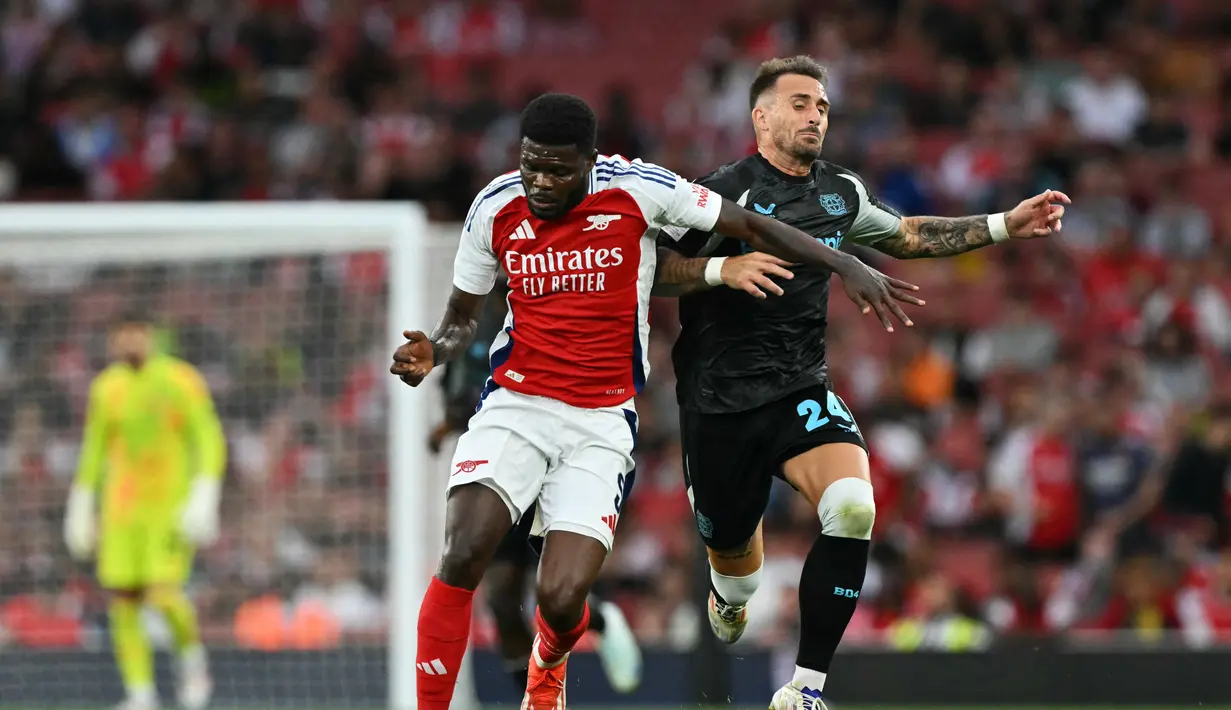 <p>The Gunners mengalahkan juara Bundesliga musim lalu dengan skor telak 4-1. (Glyn KIRK / AFP)</p>