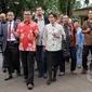 Mantan Wakil Menkumham Denny Indrayana (tengah) didampingi kuasa hukumnya mendatangi Bareskrim Polri, Jakarta, Jumat (27/3/2015). Denny diperiksa sebagai tersangka kasus dugaan korupsi payment gateway di Kemenkumham tahun 2014. (Liputan6.com/Helmi Afandi)