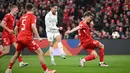 Pemain Portugal, Cristiano Ronaldo, melepaskan tendangan saat melawan Denmark dalam laga leg pertama perempat final UEFA Nations League 2024/2025 yang digelar di Stadion Parken, Copenhagen, Jumat (21/3/2025) dini hari WIB. (AFP/Jonathan Nackstrand)