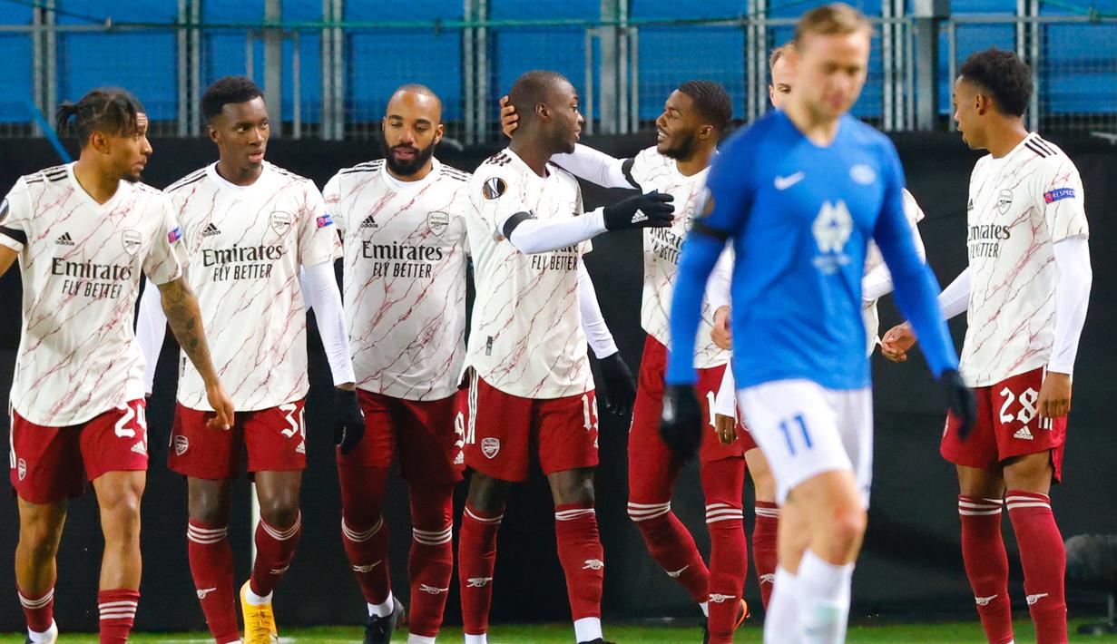 Pemain Arsenal merayakan gol yang dicetak Nicolas Pepe ke gawang Molde pada laga lanjutan Liga Europa di Aker Stadion, Jumat (27/11/2020) dini hari WIB. Arsenal menang 3-0 atas Molde. (AFP/Svein Ove Ekornesvag/NTB)
