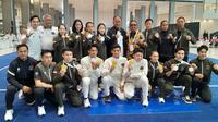 Timnas Wushu Indonesia berhasil meraih lima medali emas dan tiga medali perak di SEA Games 2025. Satu dari lima medali emas tersebut disumbangkan Patricia Geraldine (tiga dari kanan bawah) pada nomor gabungan Changquan, Jianshu dan Qiangshu yang bertanding di The Government Complex Building C, Thung Song Hong, Lak Si, Bangkok, Senin (15/12/2025). (dok. Wushu Indonesia)