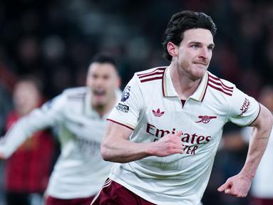 Gelandang Arsenal, Declan Rice, melakukan selebrasi setelah mencetak gol ke gawang Bournemouth pada pekan ke-20 Liga Inggris 2025/2026 di Vitality Stadium, Minggu (04/01/2026) dini hari WIB. (AP Photo/Alastair Grant)