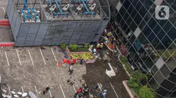 Suasana Gedung Kementerian Hukum dan Hak Asasi Manusia Republik Indonesia (Kemenkumham) seusai peristiwa kebakaran di Jalan Rasuna Said, Kuningan Jaksel, Kamis (8/12/2022). Sebanyak 26 unit dengan total 130 personel dikerahkan untuk memadamkan api yang melumat gedung tersebut. (Liputan6.com/Faizal Fanani)