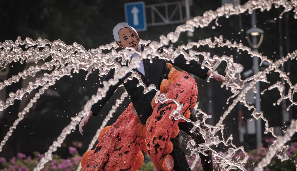 Aksi unjuk rasa tersebut untuk menyikapi beragam isu lingkungan hidup, Pemilu 2024, serta putusan Mahkamah Konstitusi terkait UU Cipta Kerja. (Yasuyoshi CHIBA/AFP)