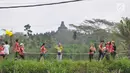 Peserta mengikuti Borobudur Marathon 2018 di Pelataran Taman Lumbini Borobudur Magelang, Minggu (18/11). Peserta Marathon terbagi 3 kategori, yakni Full Marathon 2.883 orang, Half Marathon 3.888 orang dan 10K sebanyak 2.901 orang. (Liputan6.com/Gholib)