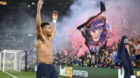 Pemain muda PSG, Desire Doue, melakukan selebrasi setelah mencetak gol ke gawang Inter Milan pada final Liga Champions 2024/2025 di Stadion Allianz Arena, Munich, Minggu (1/6/2025) dini hari WIB. (Sven Hoppe/dpa via AP)