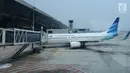 Pesawat Garuda Indonesia terparkir di Terminal 3 bandara Soekarno Hatta, Tangerang, Banten, Rabu (24/7/2019). Aturan ini merevisi kebijakan sebelumnya yang berupa imbauan tidak berfoto untuk para penumpang dan awak kabin. (Liputan6.com/Angga Yuniar)