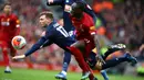 Striker Liverpool, Sadio Mane, berebut bola dengan pemain Bournemouth pada laga lanjutan Premier League 2019-2020 di Anfield, Liverpool, Sabtu (7/3) malam WIB. Liverpool menang 2-1 atas Bournemouth. (AFP/Geoff Caddick)