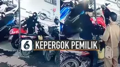 Pria itu tetap berusaha mengeluarkan motor sembari cengengesan menanggapi ASN.
