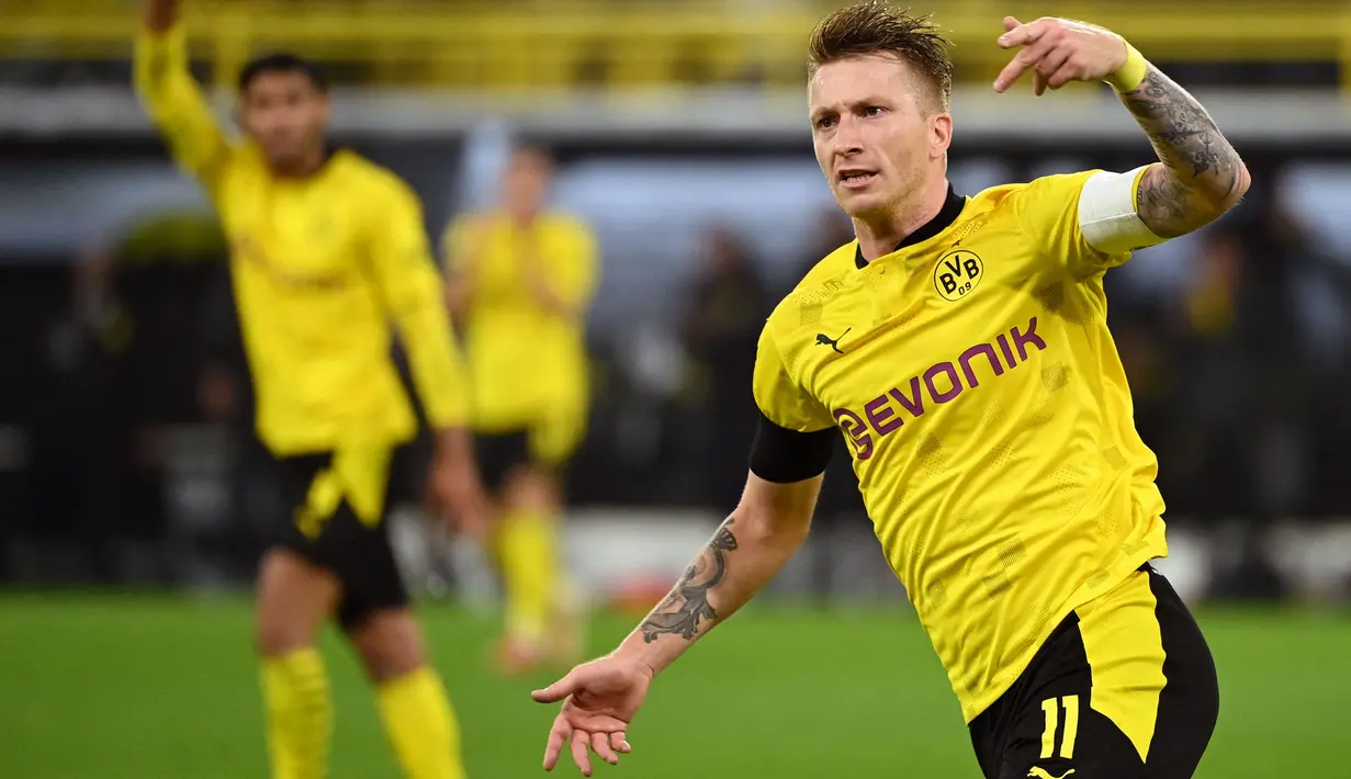 Gol balasan Borussia Dortmund benar-benar terjadi pada menit ke-64. Marco Reus sukses memanfaatkan umpan yang dilesatkan oleh Jude Bellingham ke daerah kotak pinalti. Skor pertandingan berubah menjadi 2-1. (Foto: AFP/Ina Fassbender)