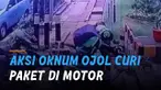 Terekam kamera cctv seorang oknum driver ojek online curi paket dalam karung di atas motor.