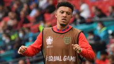 Jadon Sancho menjadi pemain anyar yang akan dinantikan penampilannya oleh fans Manchester United. Ia digadang-gadang akan menjalani debutnya kala MU melawan Leeds United pada Sabtu, 14 Agustus 2021. Sebelumnya, Ia merupakan pemain muda yang impresif di Borussia Dortmund. (Foto: AFP/Pool/Andy Rain)