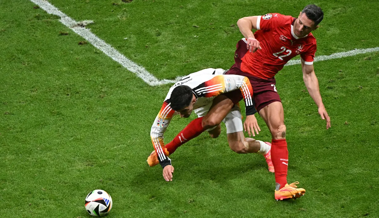 Jerman dan Swiss dipastikan lolos ke babak 16 besar Piala Eropa 2024. (JAVIER SORIANO / AFP)