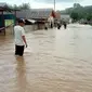 Banjir yang menerjang desa Mohungo, Kecamatan Tilamuta, Kabupaten Boalemo (Arfandi Ibrahim/Liputan6.com)