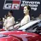 Sales Promotion Girl (SPG) berada di depan kendaraan yang dipamerkan di GIIAS 2019, ICE BSD, Kamis (25/7). Kehadiran SPG tersebut selain untuk menarik perhatian pengunjung juga bisa memberikan informasi tentang produk. (Bola.com/M Iqbal Ichsan)