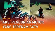 Video CCTV memperlihatkan dua orang pria melakukan aksi pencurian sepeda motor.