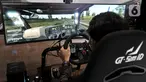 Pengunjung menjajal simulator truk yang dihadirkan Mercedes Benz di GIICOMVEC 2020, JCC Senayan, Jakarta, Minggu (8/3/2020). Mercedes Benz menghadirkan simulator truk dan bus dalam GIICOMVEC 2020 sehingga pengunjung dapat merasakan sensasi mengendarai kendaraan besar. (merdeka.com/Iqbal Nugroho)