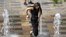 <p>Beijing dan sebagian China utara mengalami rekor suhu, dengan pihak berwenang mendesak orang untuk membatasi waktu mereka di luar rumah. (AP Photo/Mark Schiefelbein)</p>