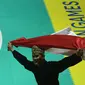 Pesilat Indonesia Sugianto melakukan selebrasi usai berlaga pada babak final Artistik tunggal putra di arena Padepokan Pencak silat TMII, Jakarta, Rabu (29/8). Sugianto berhasil meraih emas. (Merdeka.com/Imam Buhori)