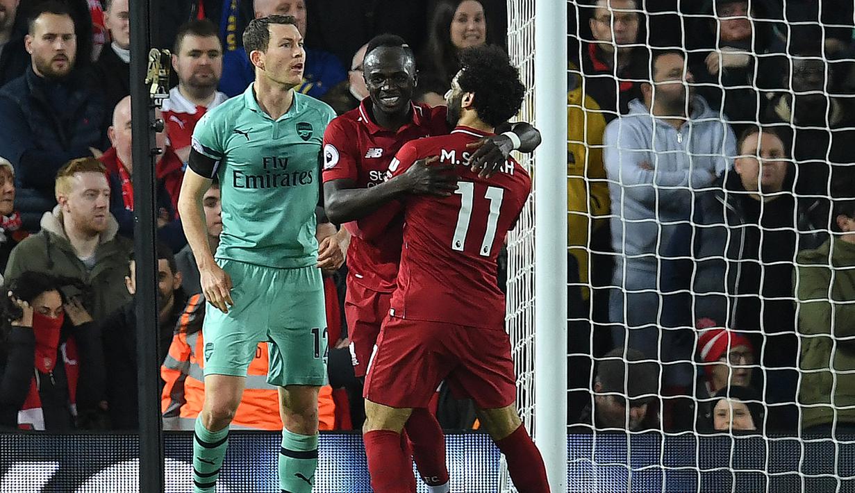 Musim 2018/2019. Pada musim 2018/2019, tiga striker asing harus berbagi gelar top skor Liga Inggris karena sama-sama mencetak 22 gol di musim tersebut. Mereka adalah Pierre-Emerick Aubameyang (Gabon) serta dua pemain Liverpool, Mohamed Salah (Mesir) dan Sadio Mane (Senegal). Ketajaman keduanya hampir membawa Liverpool merebut gelar juara Liga Inggris dan harus puas menjadi runner-up, hanya terpaut 1 poin dengan Manchester City yang tampill sebagai juara. (AFP/Paul Ellis)