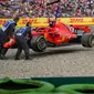 Pebalap Ferrari, Sebastian Vettel, tak mampu finis pada GP Jerman karena mengalami kecelakaan pada lap ke-52. (AFP/Andrej Isakovic)
