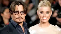 Johnny Depp dan Amber Heard. (foto: usmagazine)