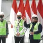 Menteri BUMN Erick Thohir mendampingi Presiden Joko Widodo dalam seremoni penutupan atap (topping off) stadion Indoor Multifunction Stadium (IMS) di kawasan Gelora Bung Karno (GBK), Jakarta