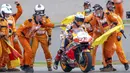 Para marshal merayakan kemenangan pembalap Marc Marquez pada balapan MotoGP di Sirkuit Sachsenring, Hohenstein-Ernstthal, Jerman, Minggu (20/6/2021). Marc Marquez mempertegas status sebagai raja Sachsenring usai memenangkan MotoGP Jerman 2021. (Jens Buettner/dpa via AP)