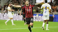 Pemain AC Milan, Christian Pulisic, merayakan gol ke gawang Lecce dalam laga babak kedua Coppa Italia 2025/2026 di San Siro, Milan, Rabu (24/9/2025) dini hari WIB. AC Milan melangkah ke 16 besar lewat kemenangan telak 3-0. (AP Photo/Luca Bruno)