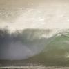 Seorang peselancar mengendarai ombak di Blacks Beach, San Diego, California, Amerika Serikat, 12 Januari 2022. Peselancar di seluruh California Selatan berbondong-bondong ke daerah pantai saat gelombang ombak besar memasuki wilayah tersebut. (AP Photo/Gregory Bull)