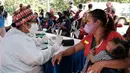 Warga yang tergabung komunitas pemulung mengikuti vaksinasi Covid-19 di Tempat Pembuangan Sampah Terakhir (TPST) Bantar Gebang, Kota Bekasi (29/10/2021). Program vaksinasi yang diikuti 1.000 anggota berlangsung pada 29 - 31 Oktober. (Liputan6.com/HO/Unilever)