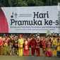 Peserta mengikuti upacara Hari Pramuka ke-56 serta pembukaan Raimuna Nasional XI, Jakarta, Senin (13/8). Penyelenggaraan ini menghadirkan perwakilan tiap kabupaten/kota, masing-masing 24 orang dari seluruh Indonesia. (Liputan6.com/Faizal Fanani)